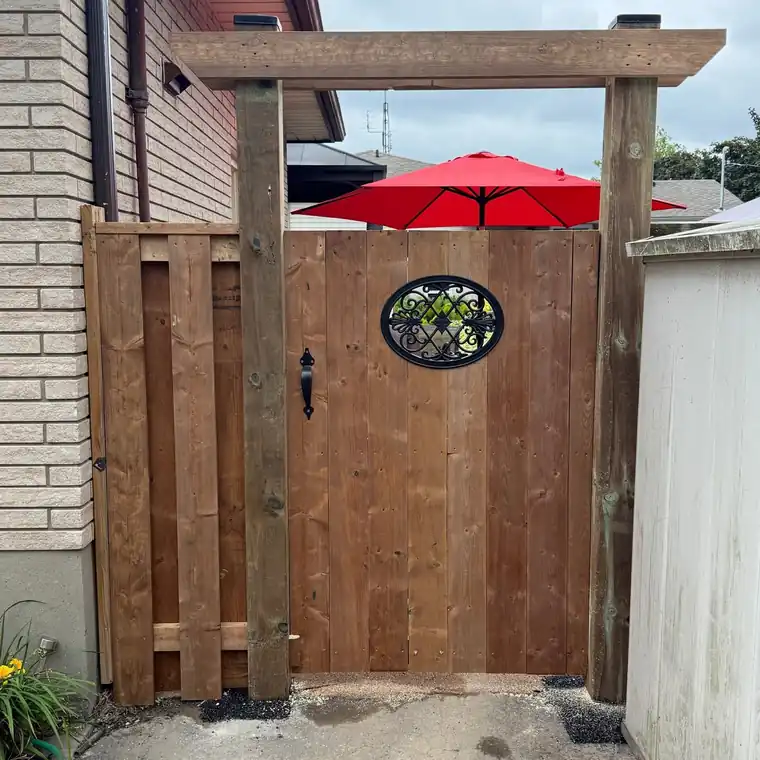 Completed custom wood gate with decorative detail