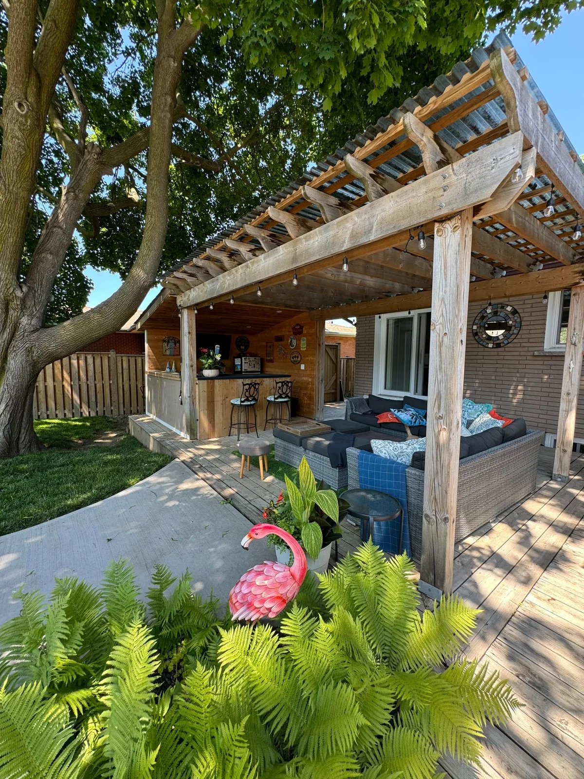 Completed wood pergola over a deck dining area